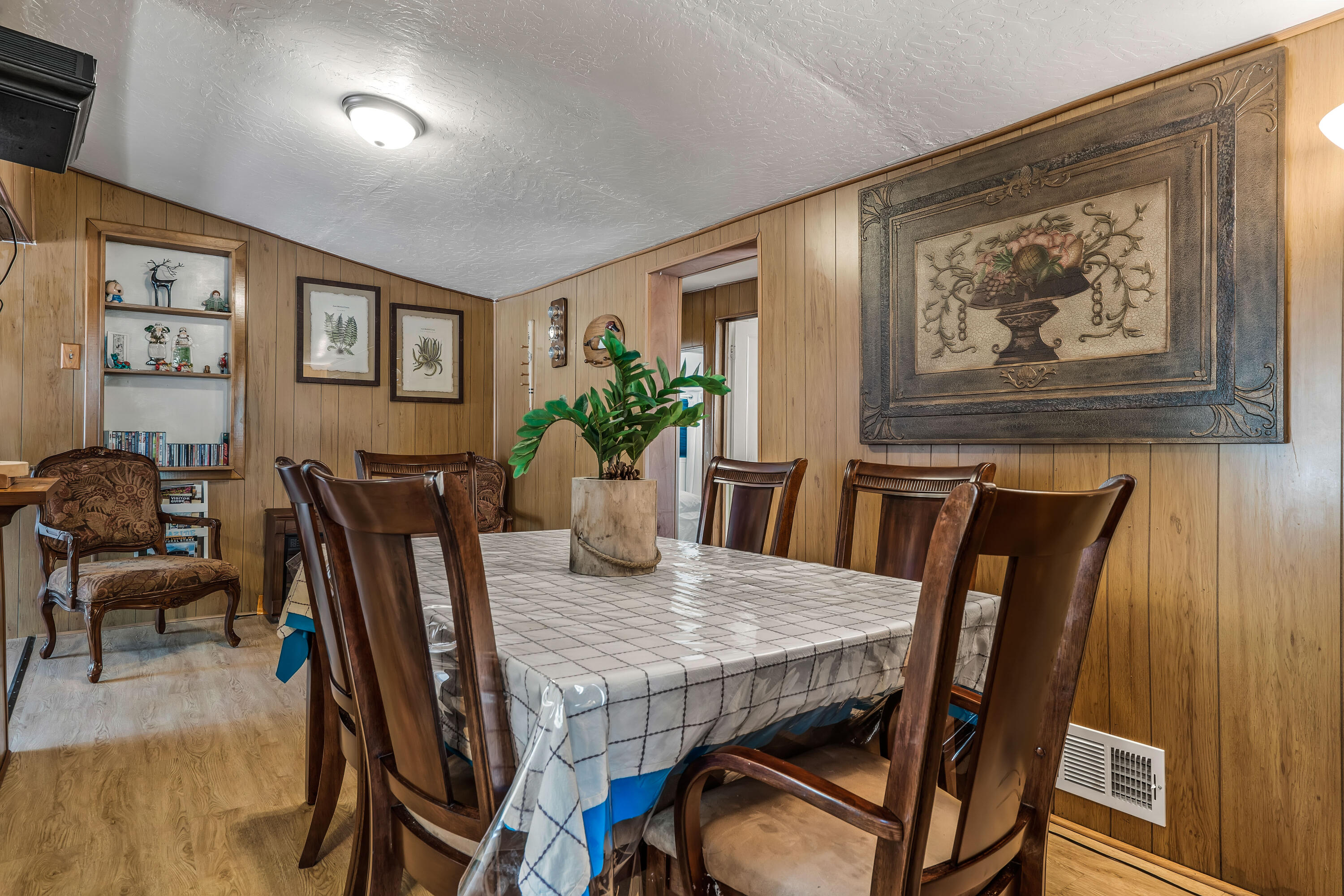 23061 Banning Idyllwild Road Idyllwild, CA 92549 - Photo 16 of 46 a view of a dining room with furniture and wooden floor