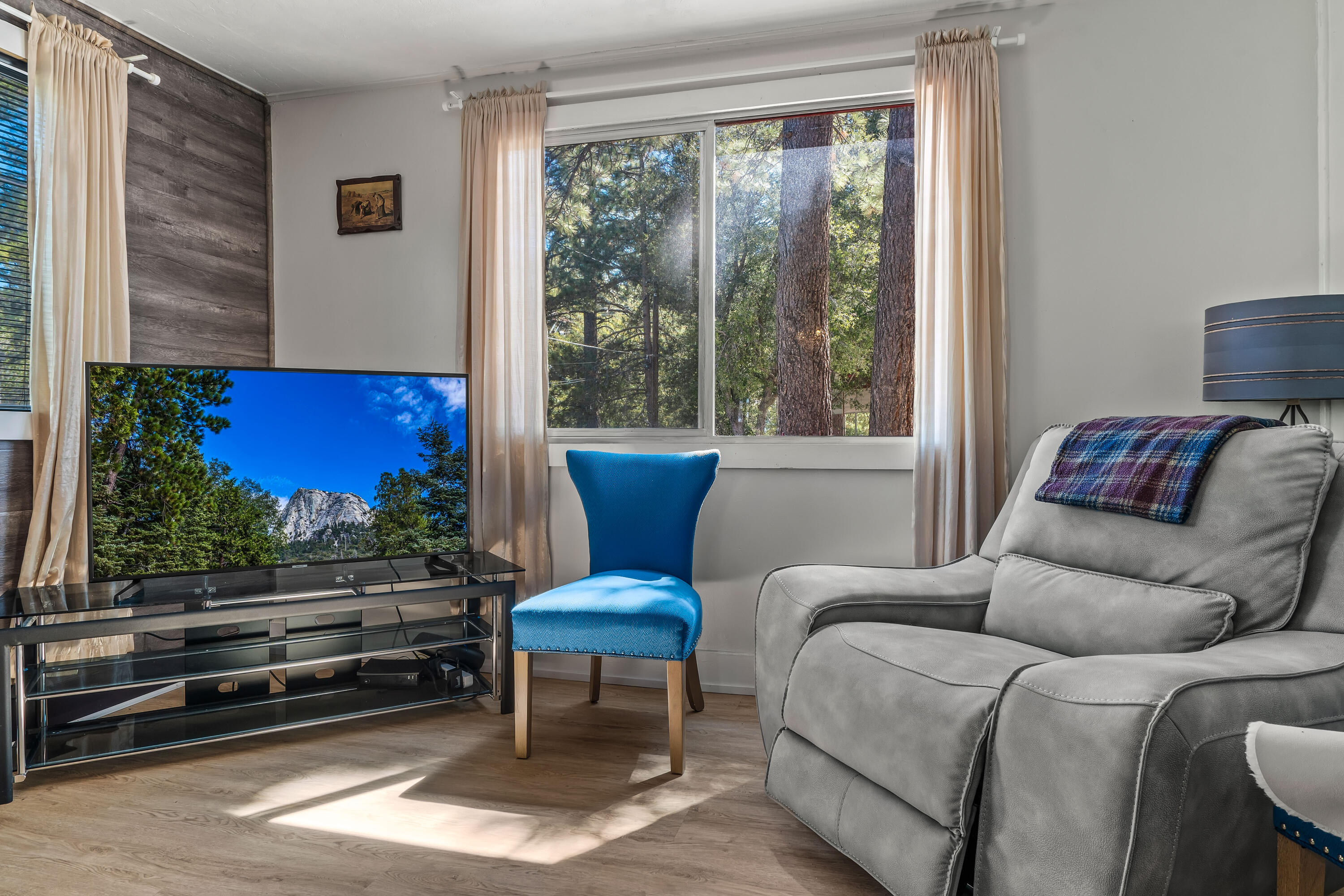 23061 Banning Idyllwild Road Idyllwild, CA 92549 - Photo 22 of 46 a living room with furniture a rug and a window