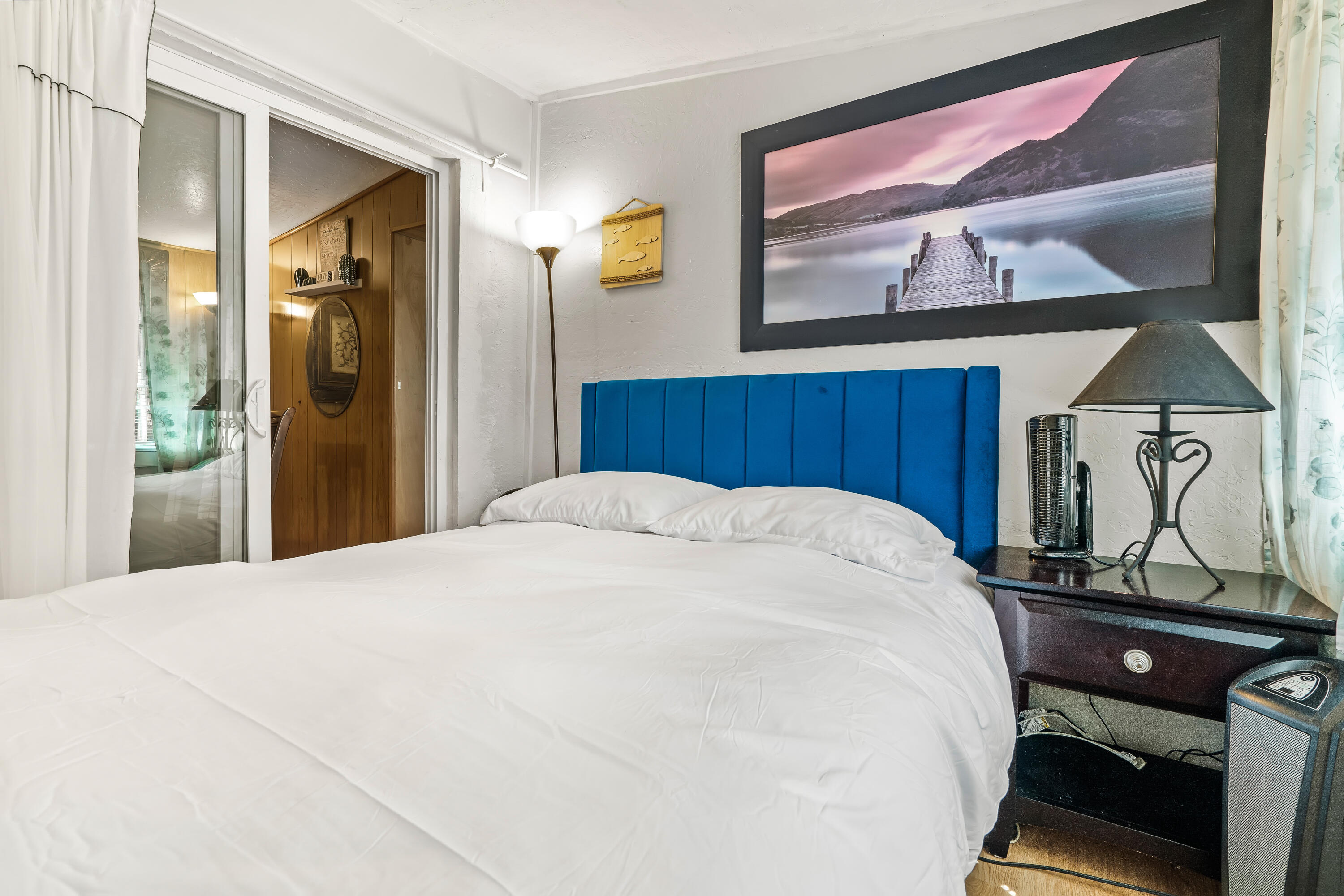 23061 Banning Idyllwild Road Idyllwild, CA 92549 - Photo 26 of 46 a bedroom with a bed and painting on the wall