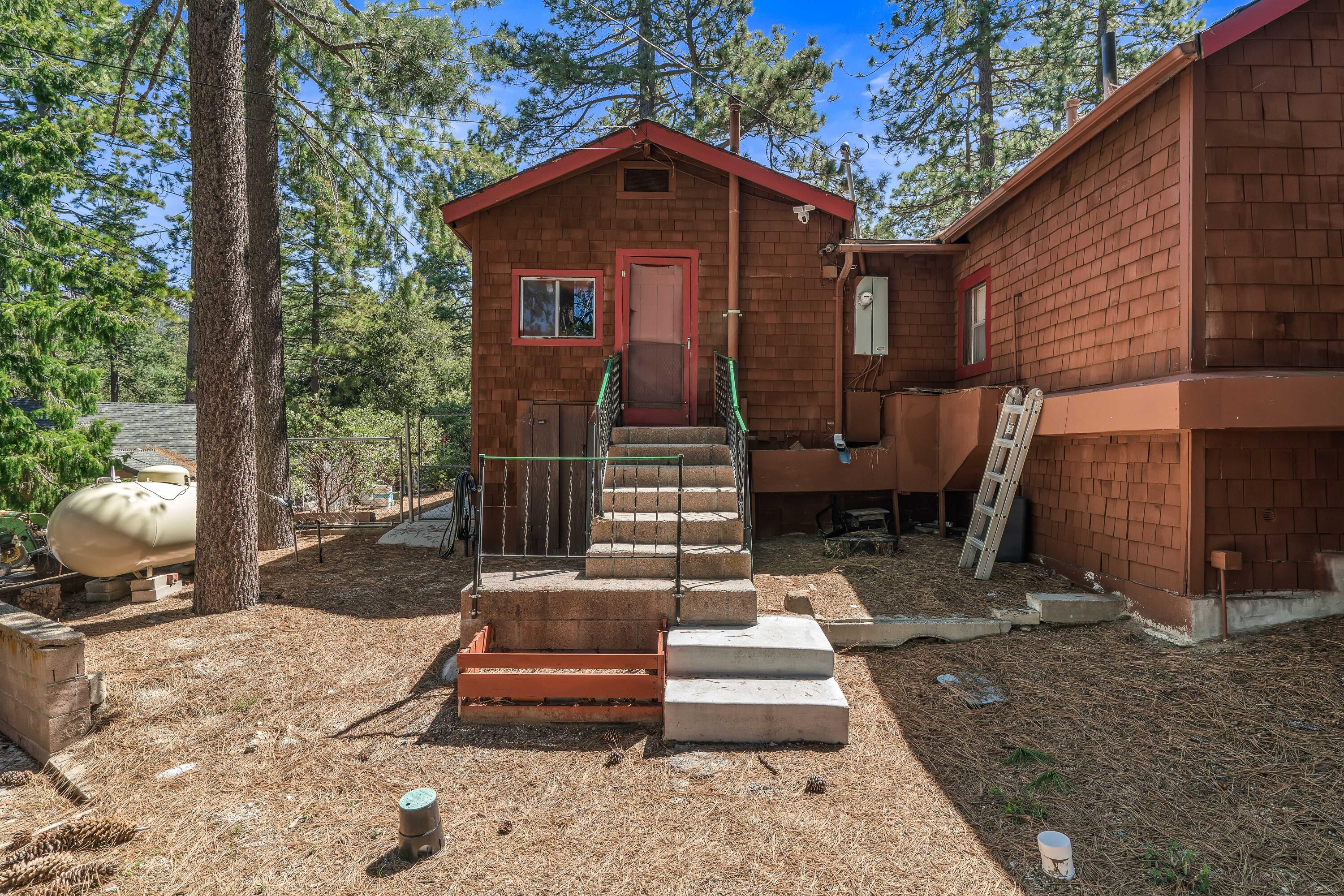 23061 Banning Idyllwild Road Idyllwild, CA 92549 - Photo 33 of 46 a front view of a house with a yard