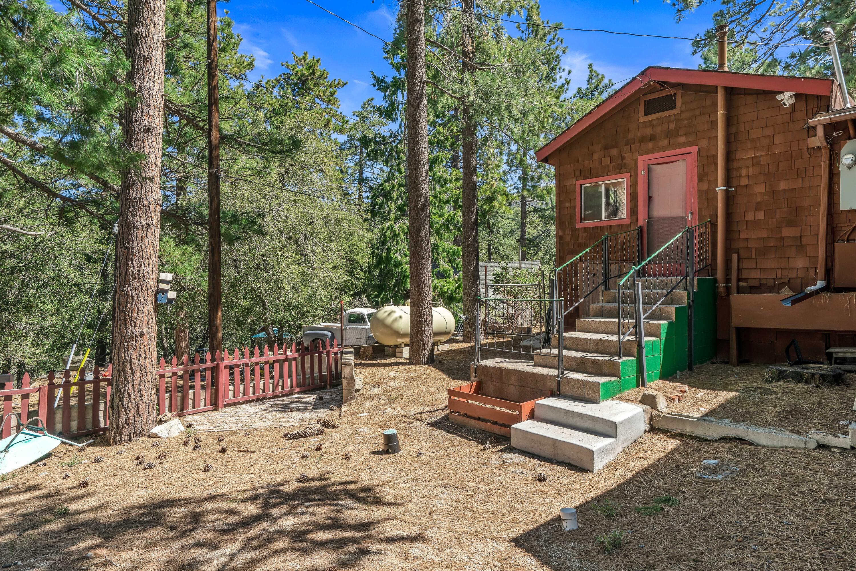 23061 Banning Idyllwild Road Idyllwild, CA 92549 - Photo 34 of 46 a view of a chair and table in the backyard