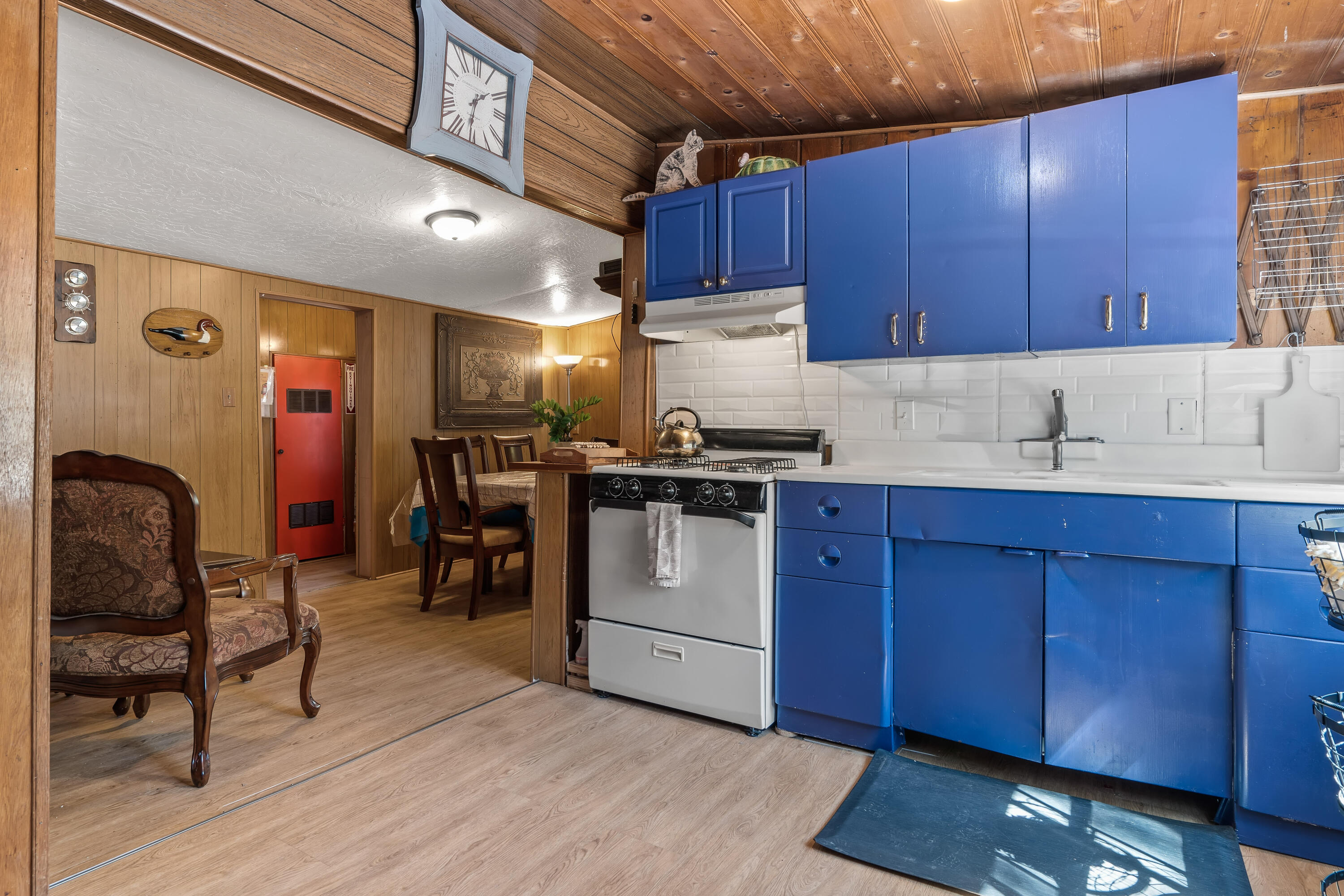 23061 Banning Idyllwild Road Idyllwild, CA 92549 - Photo 9 of 46 a kitchen with stainless steel appliances granite countertop wooden cabinets a stove a sink and dishwasher