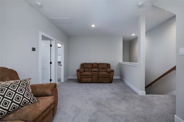 a living room with furniture and windows