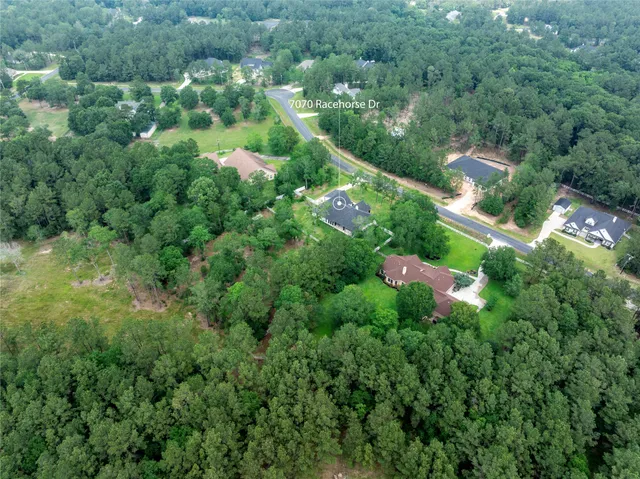 an aerial view of residential house with outdoor space and street view