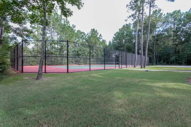 a backyard of a house with trampoline