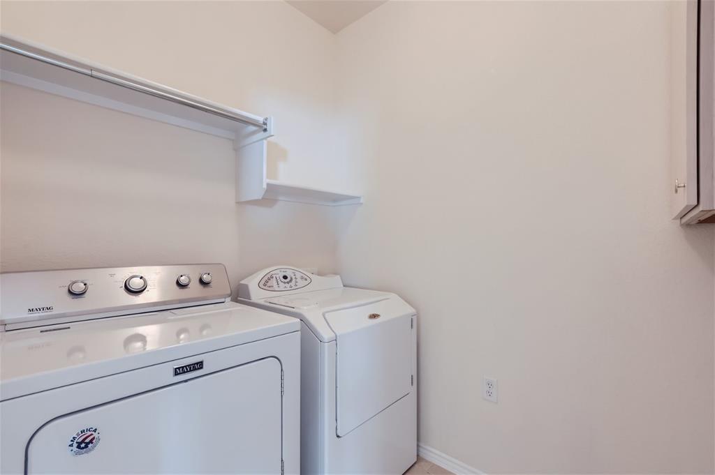 212 Summer Road Georgetown, TX 78633 - Photo 18 of 18 a view of storage room with washer and dryer