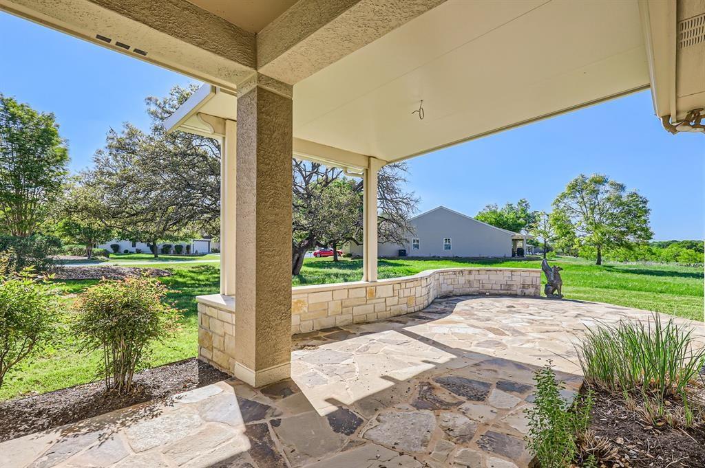 212 Summer Road Georgetown, TX 78633 - Photo 2 of 18 a view of a patio with a garden