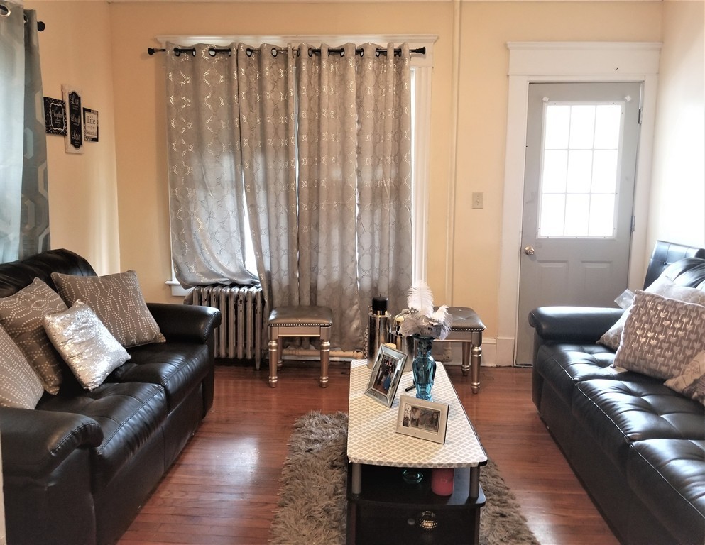 117-119 Ranney Street Springfield, MA 01108 - Photo 4 of 17 a living room with furniture and a window
