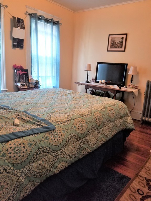 117-119 Ranney Street Springfield, MA 01108 - Photo 9 of 17 a bedroom with bed and window