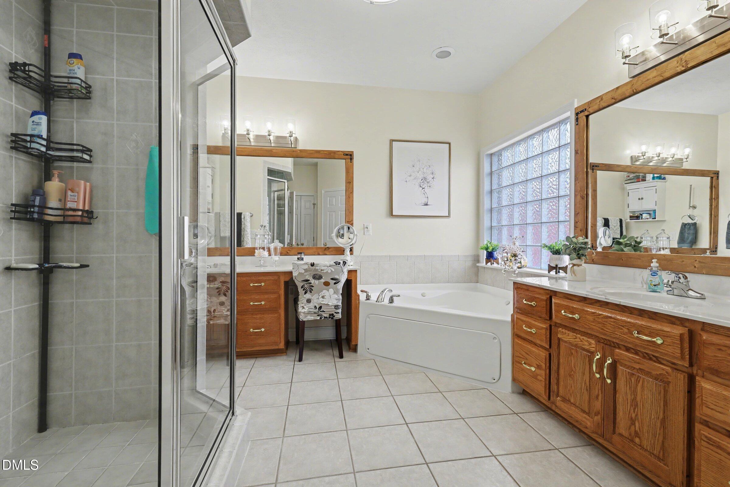 430 Fred Hall Road Stedman, NC 28391 - Photo 24 of 63 a bathroom with a granite countertop sink a toilet and shower