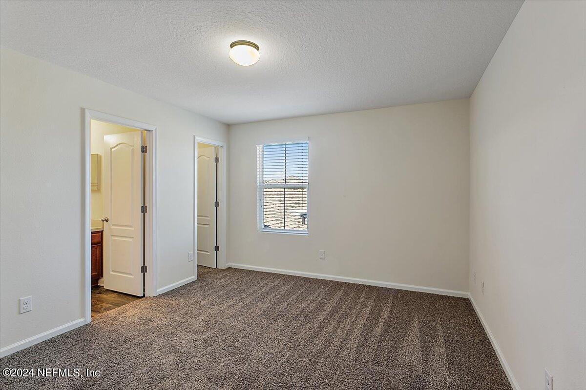 225 Whitland Way St. Augustine, FL 32086 - Photo 11 of 17 an empty room with windows