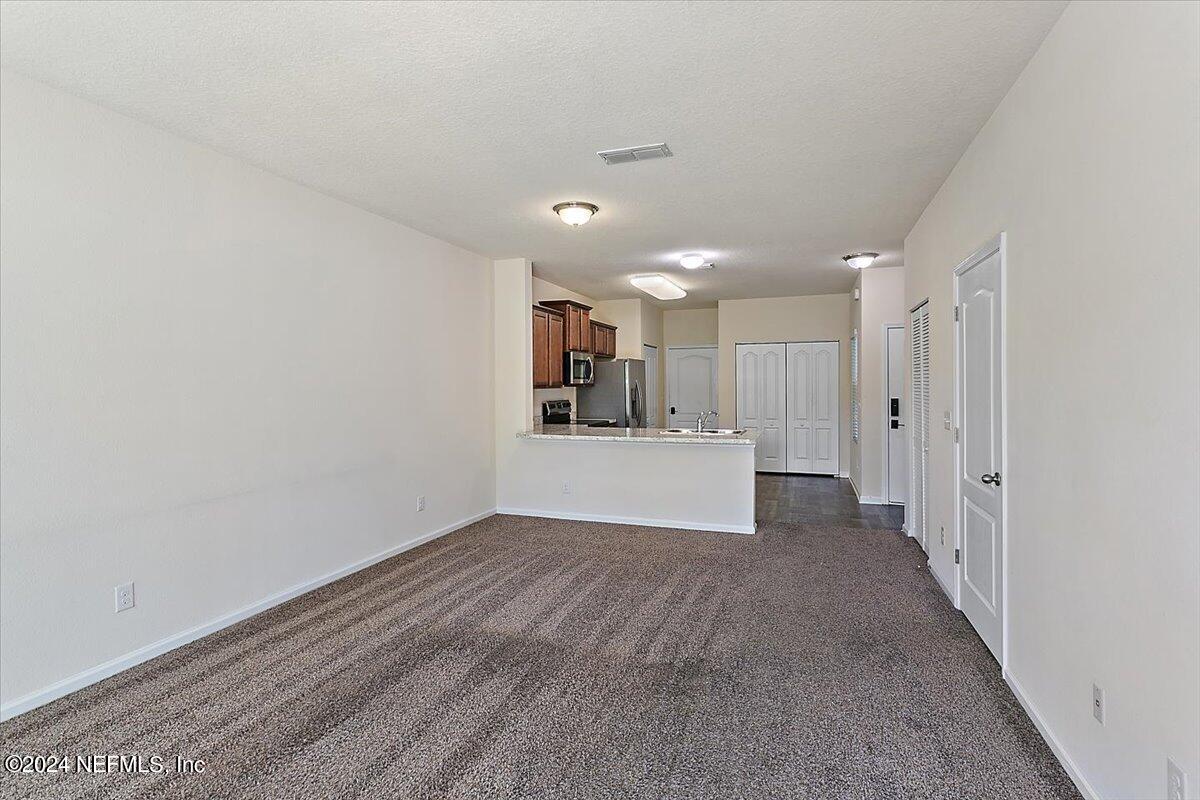 225 Whitland Way St. Augustine, FL 32086 - Photo 5 of 17 a view of a kitchen with a sink and cabinets