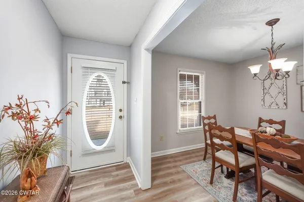 a dining room with furniture and window