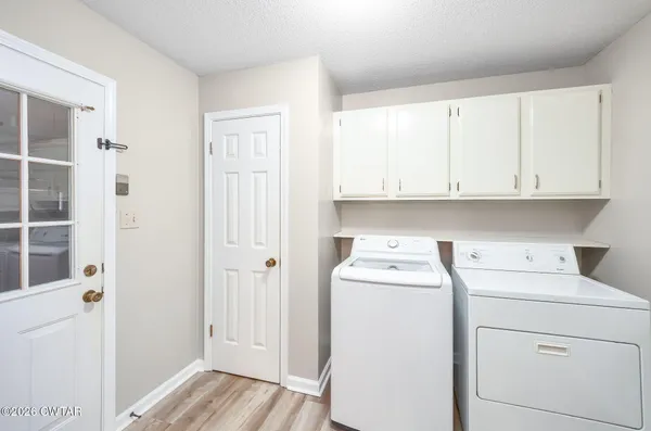 a view of storage and utility room with washer and dryer