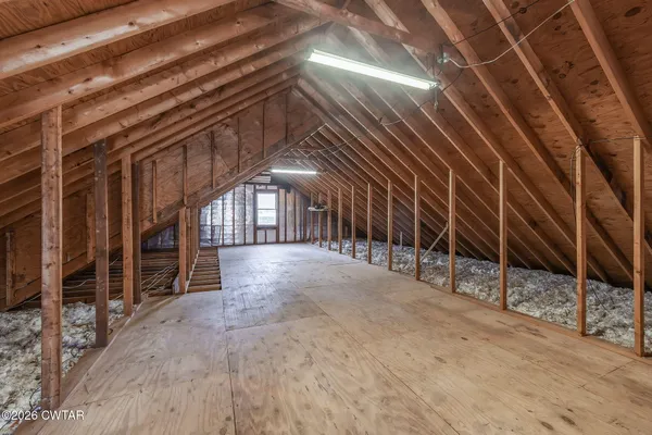 a view of an empty room with wooden roof