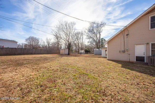 a view of large yard with a house