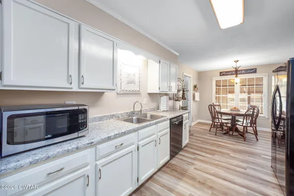a kitchen with granite countertop cabinets stainless steel appliances a sink and a counter top space