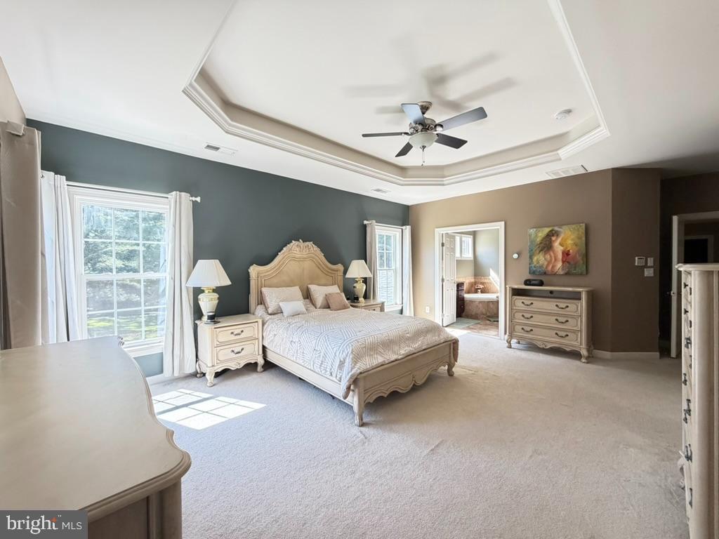 9804 Anvil Court Perry Hall, MD 21128 - Photo 12 of 21 a spacious bedroom with a bed and a large window