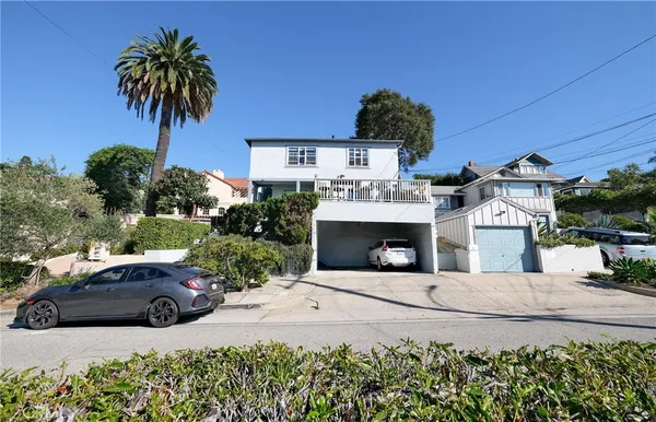 a view of a car parked in front of a house