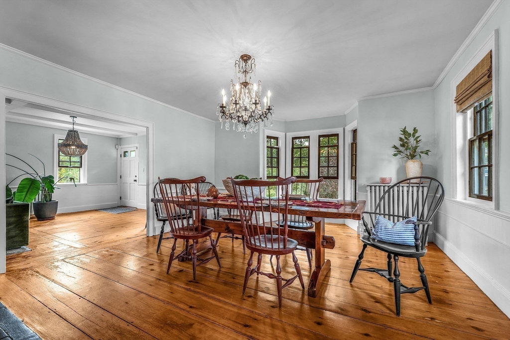 180 Elm Street Hanover, MA 02339 - Photo 12 of 30 a view of a dining room with furniture window and wooden floor