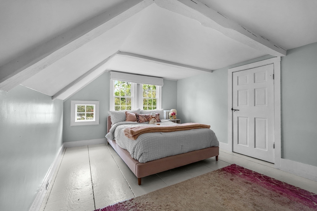 180 Elm Street Hanover, MA 02339 - Photo 18 of 30 a bed room with a bed and a window