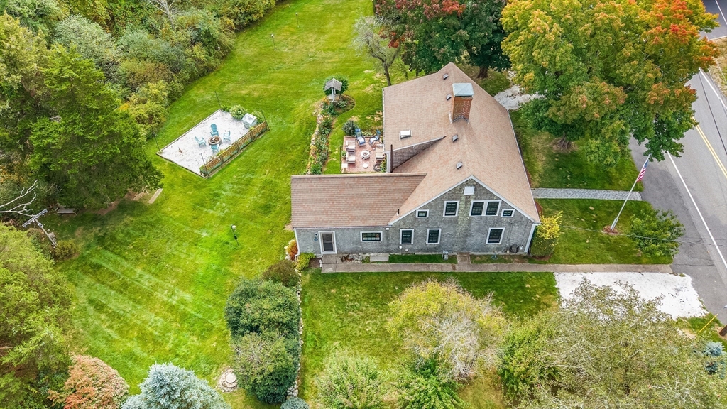180 Elm Street Hanover, MA 02339 - Photo 2 of 30 an aerial view of a house with swimming pool and garden