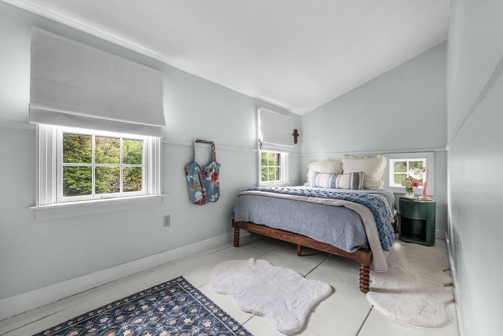 180 Elm Street Hanover, MA 02339 - Photo 24 of 30 a bedroom with a bed and window