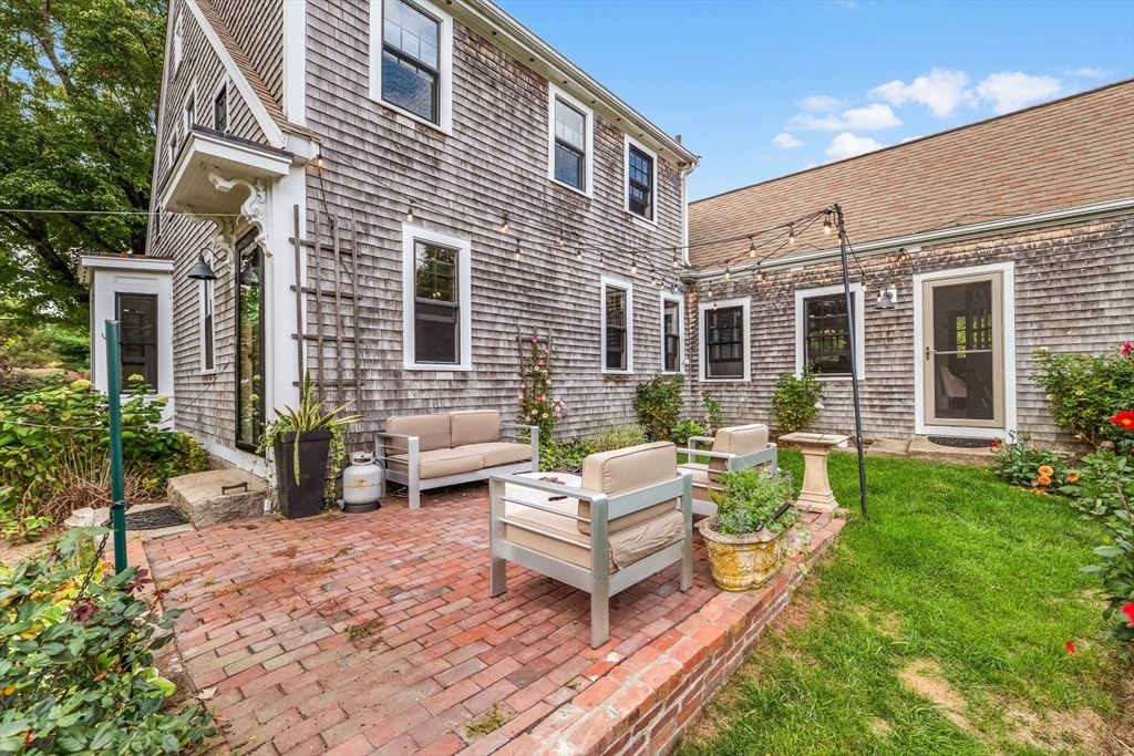 180 Elm Street Hanover, MA 02339 - Photo 27 of 30 a view of a house with backyard and sitting area
