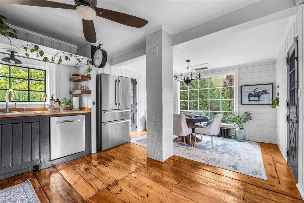 180 Elm Street Hanover, MA 02339 - Photo 3 of 30 a kitchen with stainless steel appliances kitchen island granite countertop a refrigerator and microwave
