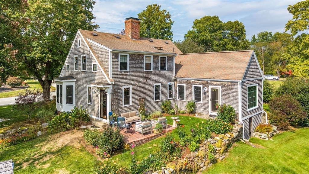 180 Elm Street Hanover, MA 02339 - Photo 5 of 30 a aerial view of a house with yard porch and furniture