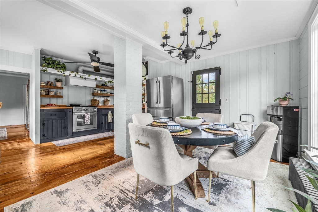 180 Elm Street Hanover, MA 02339 - Photo 8 of 30 a view of a dining room with furniture and a chandelier