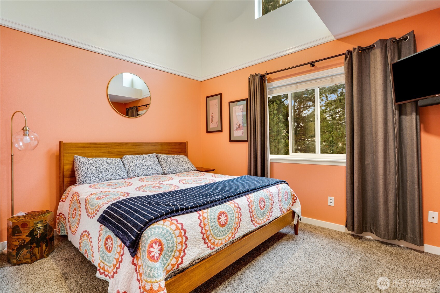 10319 Midvale Avenue North, Unit A Seattle, WA 98133 - Photo 15 of 34 a bed sitting in a bedroom next to a window