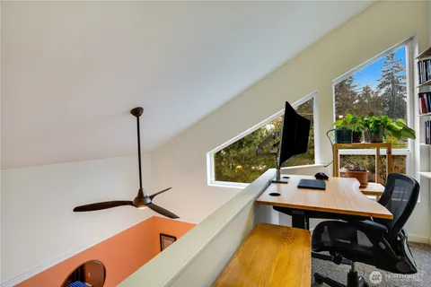 a view of a workspace with a flat screen tv