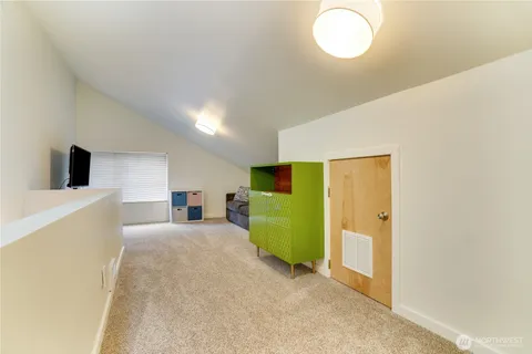 a view of a livingroom with furniture and a window