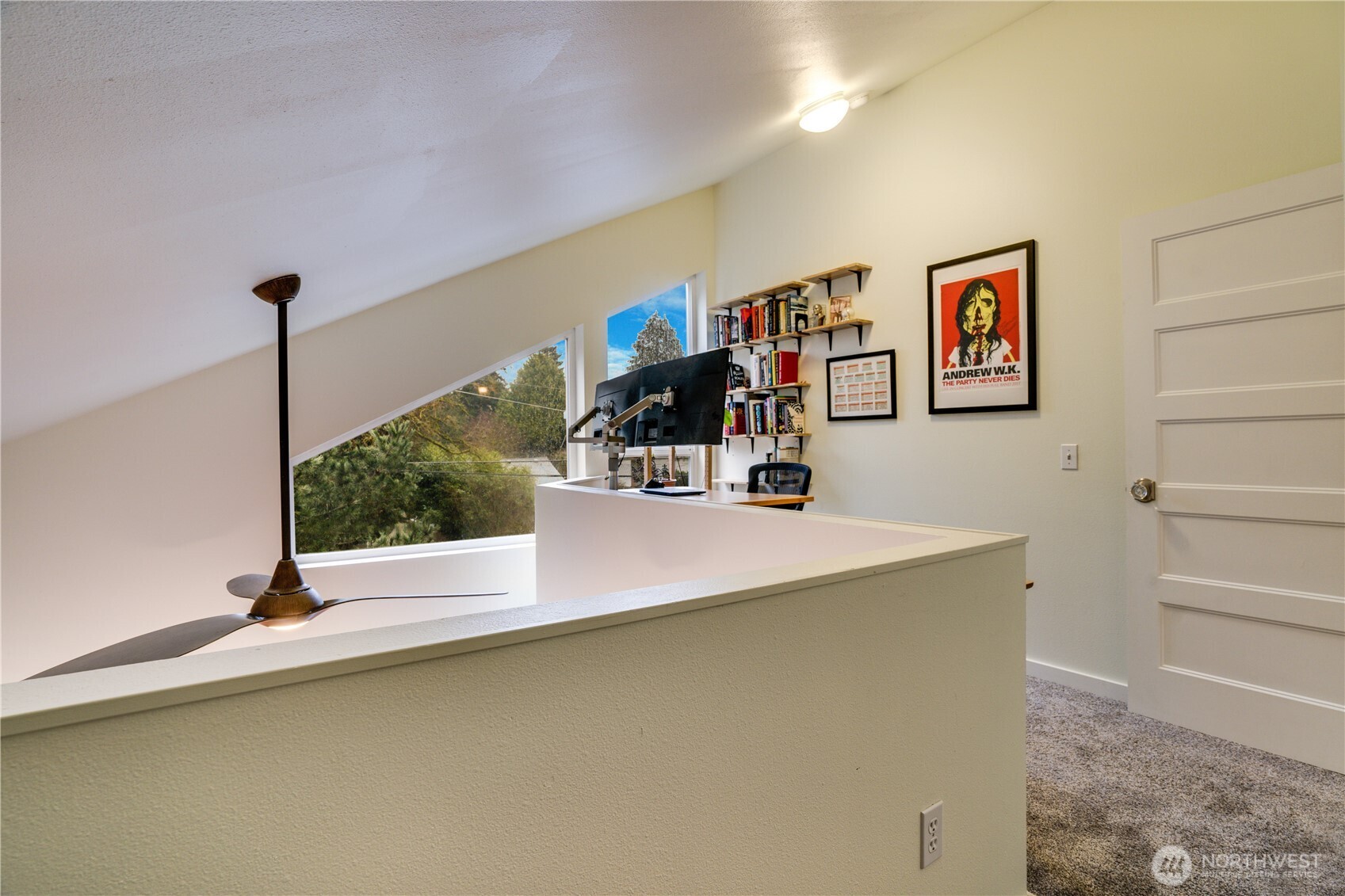 10319 Midvale Avenue North, Unit A Seattle, WA 98133 - Photo 28 of 34 a view of a living room with furniture and floor to ceiling window