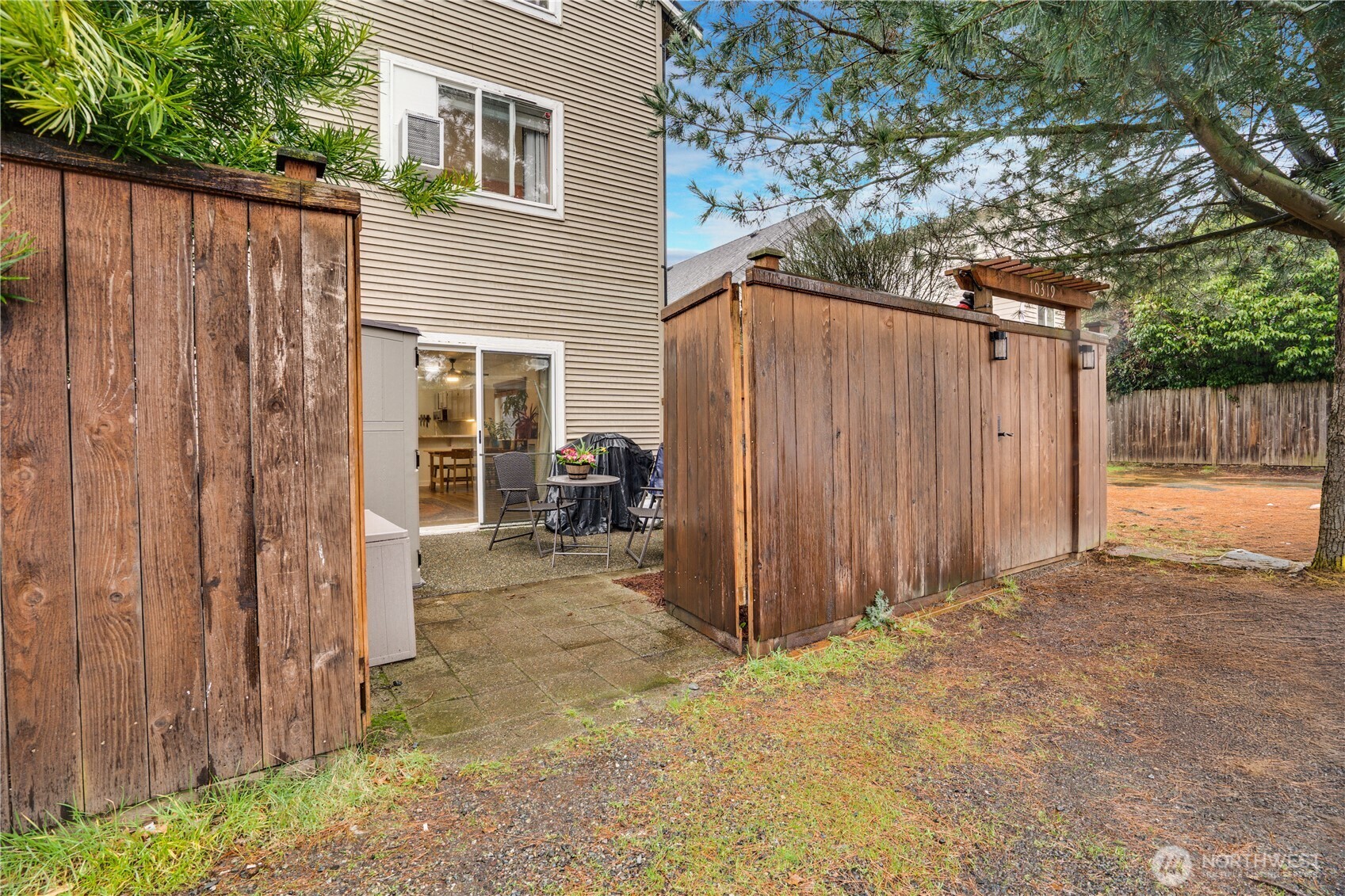 10319 Midvale Avenue North, Unit A Seattle, WA 98133 - Photo 34 of 34 a view of a house with backyard and wooden fence