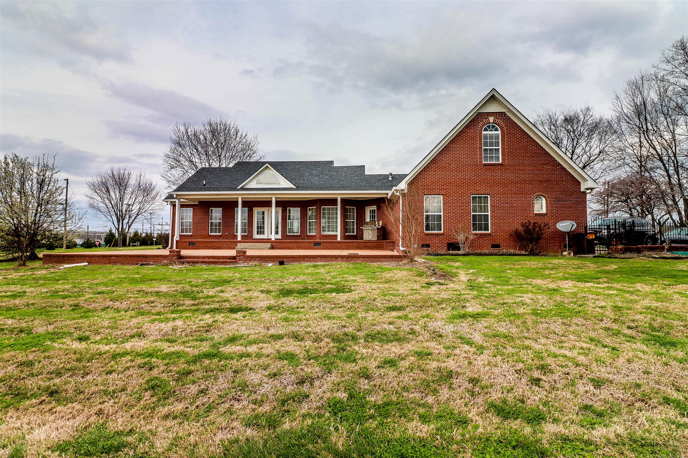 3290 Greens Mill Road Spring Hill, TN 37174 - Photo 22 of 24 a front view of a house with garden