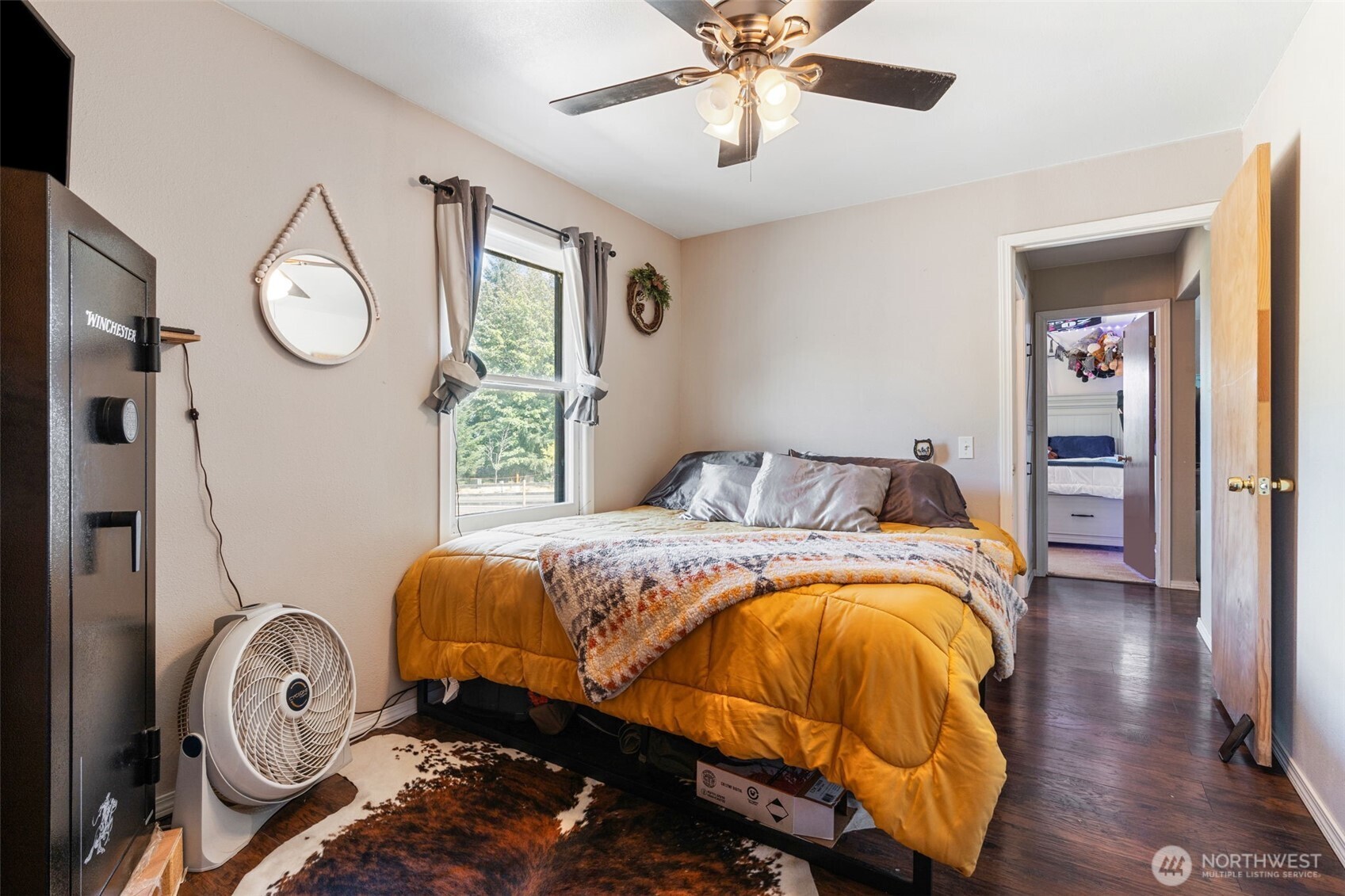 248 Crego Hill Road Chehalis, WA 98532 - Photo 13 of 39 a bedroom with a bed and a chandelier