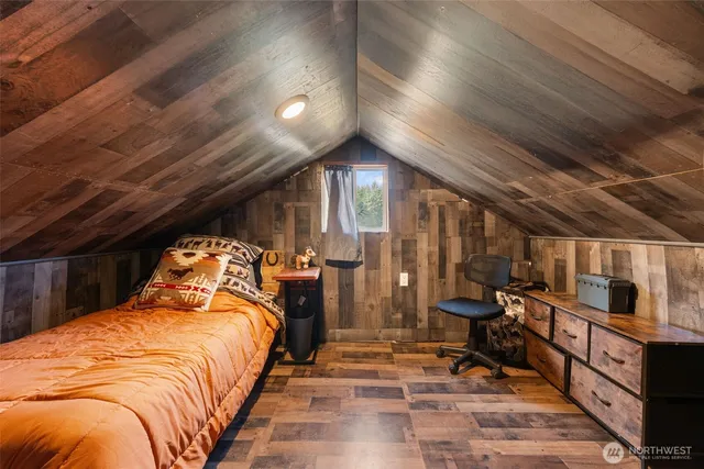 a bed room with a bed and a walk in closet