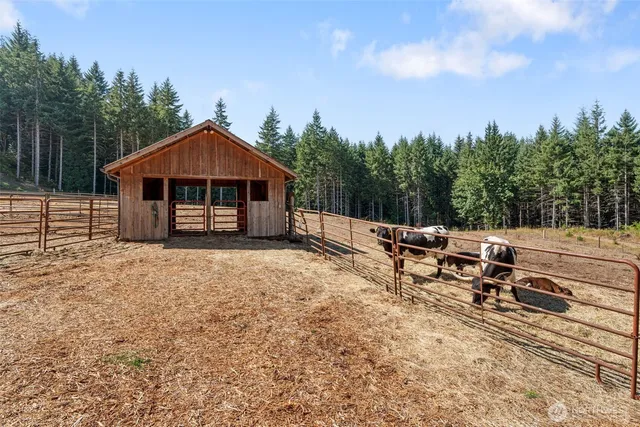 a view of a house with a yard and sitting area