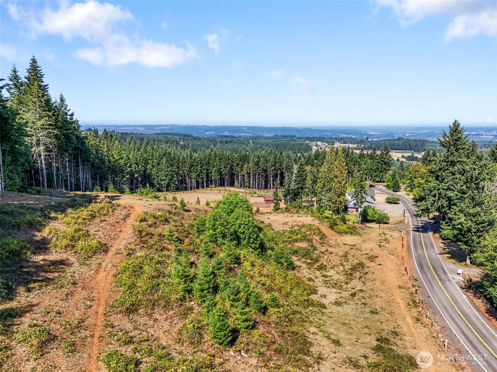 248 Crego Hill Road Chehalis, WA 98532 - Photo 36 of 39 a view of a yard with a house in the background