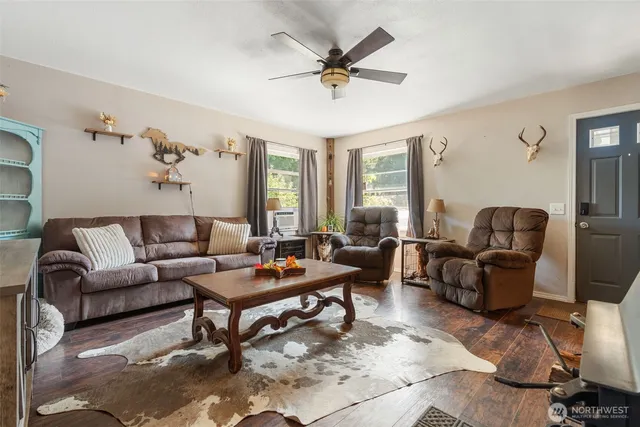 a living room with furniture and a large window