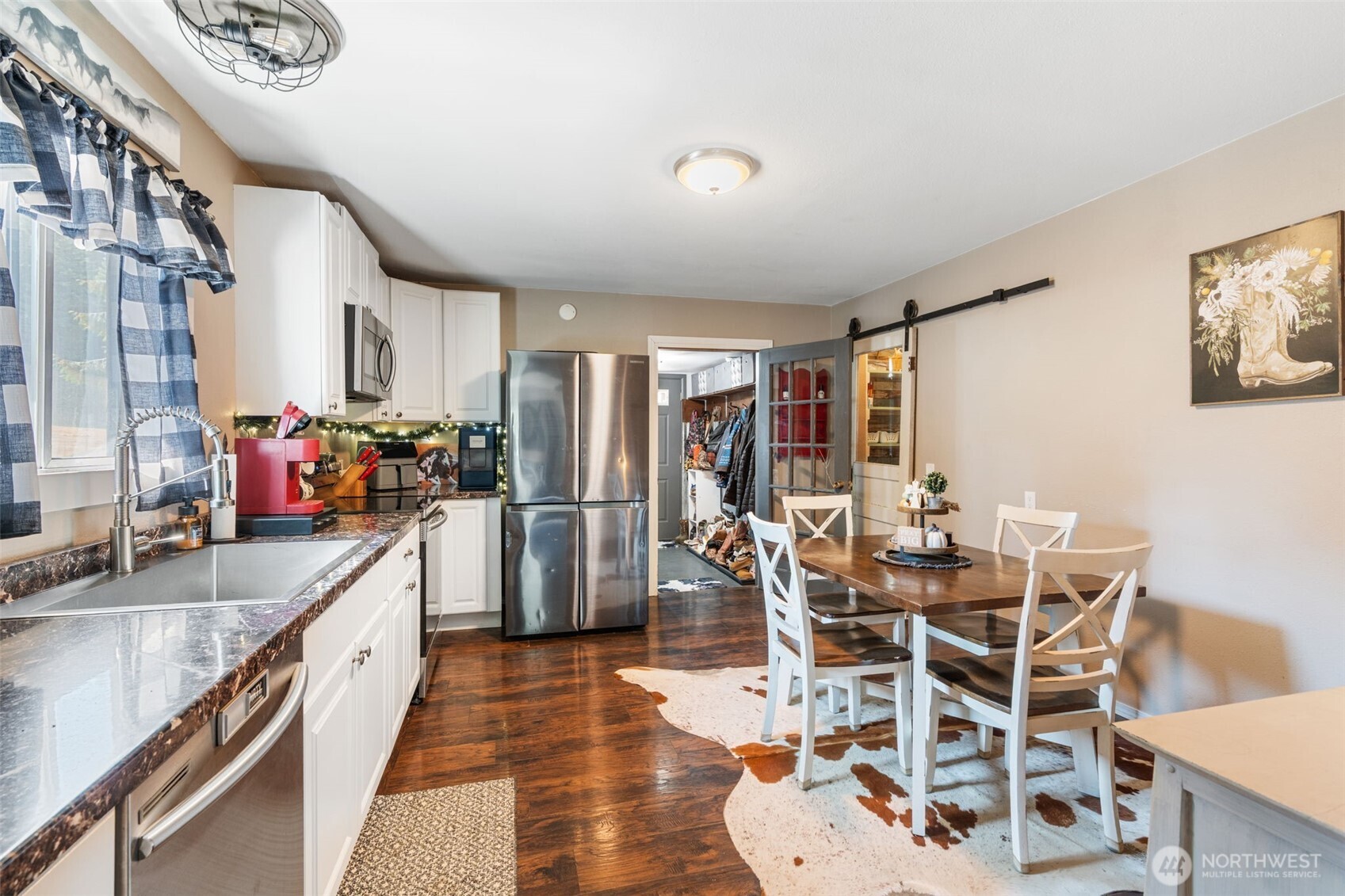 248 Crego Hill Road Chehalis, WA 98532 - Photo 6 of 39 a kitchen with stainless steel appliances granite countertop a sink and a refrigerator
