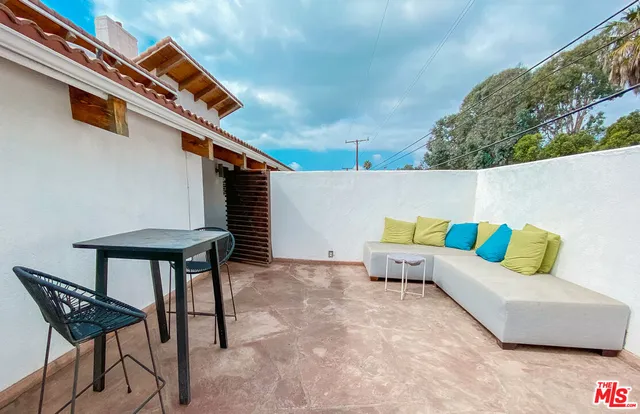a view of a livingroom with wooden floor and closet