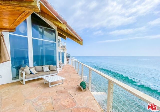 a balcony with view of ocean
