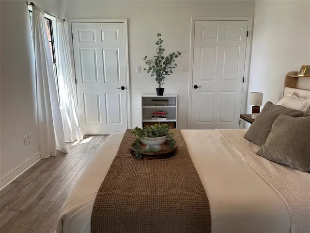 a bedroom with a bed and a couch