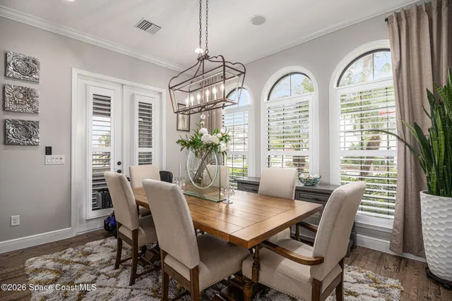 a view of a dining room with furniture window and wooden floor