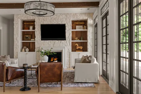 a large kitchen with a table and chairs