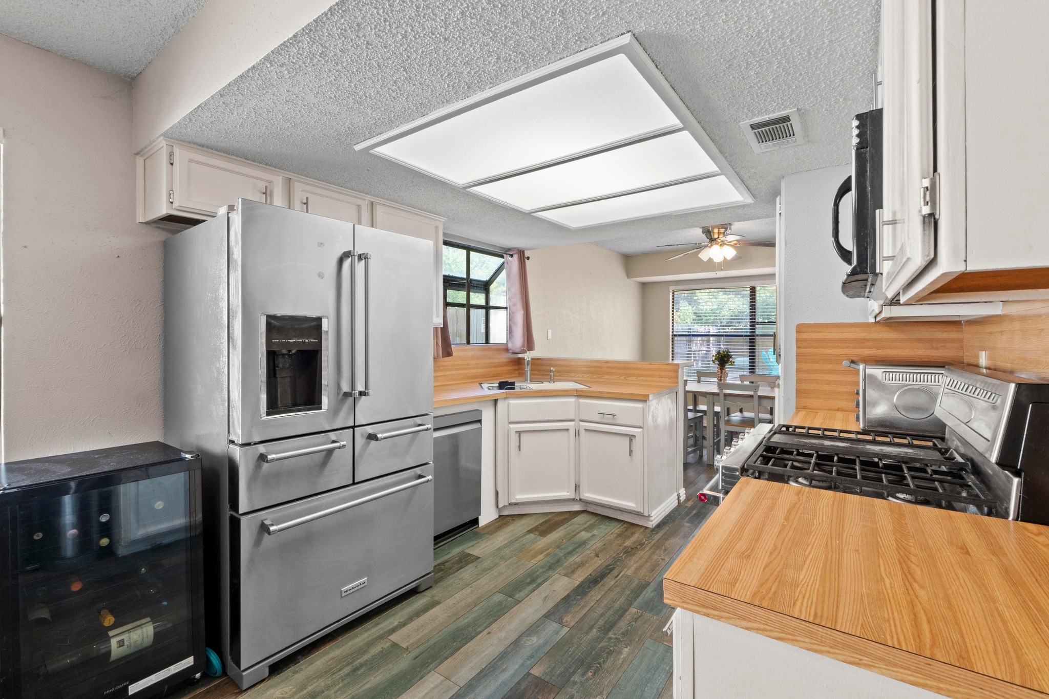 811 Timber Trail Cedar Park, TX 78613 - Photo 15 of 30 a kitchen with stainless steel appliances granite countertop a stove a sink dishwasher and a refrigerator
