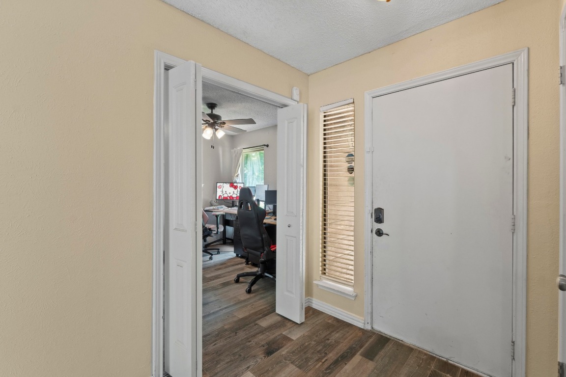 811 Timber Trail Cedar Park, TX 78613 - Photo 18 of 30 a view of a hallway to a livingroom and a dinning area with furniture